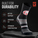 Black crew height sock with red and white MudGear branding, displayed on stone surface