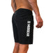 Black men's running shorts with MudGear logo on leg, shown on model from waist to mid-thigh