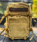 Desert khaki rucking backpack with molle webbing, padded shoulder straps, and Run Ruck Lift Live patch