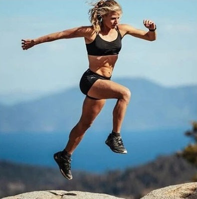 Trail Runner Rea Koble leaps with MudGear Trail Running Socks