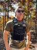 Man wearing Centurion Weight Vest Phoenix Tiger Stripe in forest setting