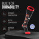 Mesa Horizon tall compression socks in black with red cuff and geometric patterning, displayed on gray platform