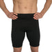 Man wearing black MudGear compression shorts, front view